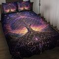 Tree Of Life quilt blanket displayed on a bed with cosmic moons and purple celestial artwork