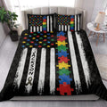 Autism quilt blanket styled in a bright bedroom with colorful puzzle pieces and awareness ribbon artwork