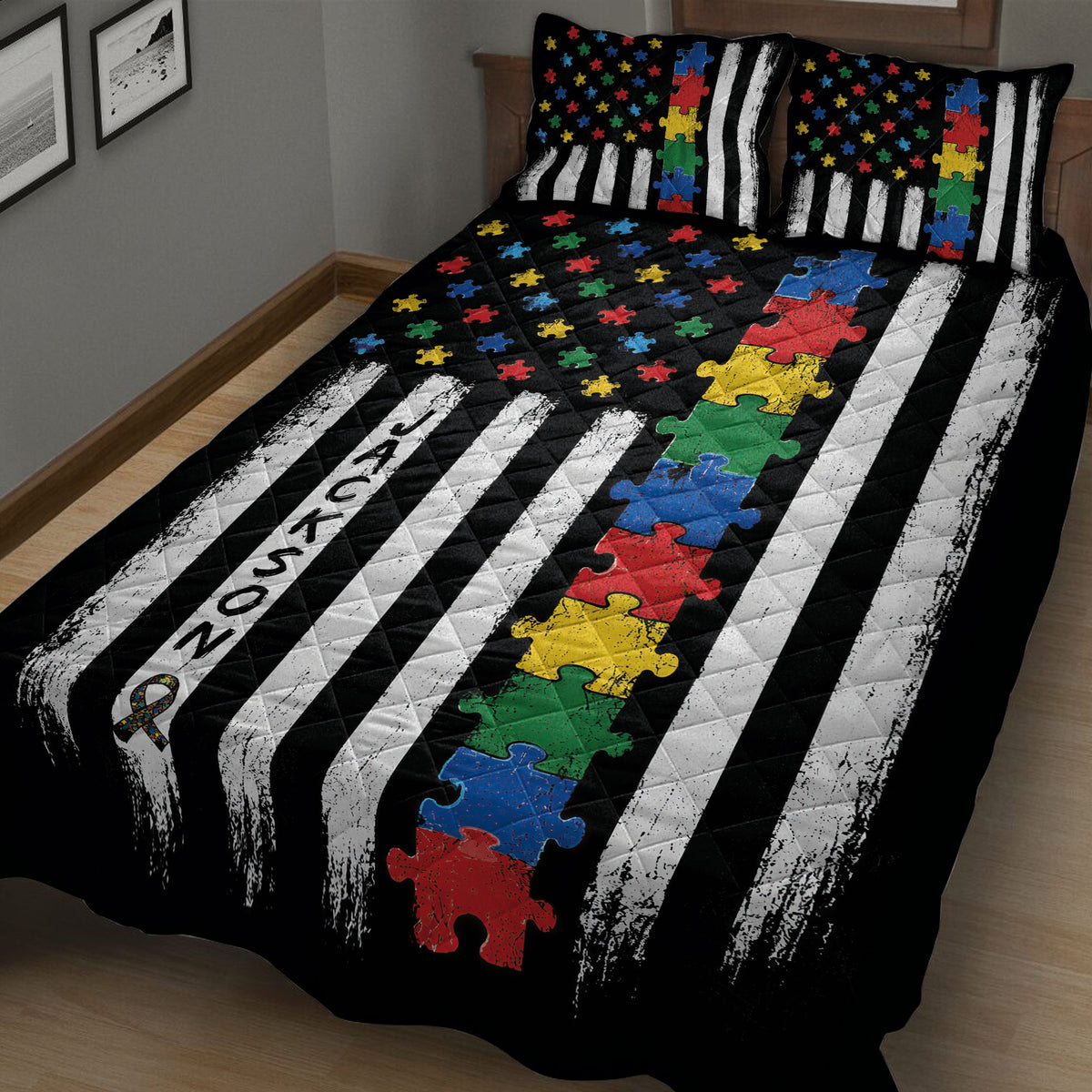 Angled bedroom view of an autism quilt blanket with colorful puzzle pieces and black and white striped design