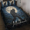 Bigfoot quilt blanket displayed on a bed with moonlit forest artwork in deep blue tones