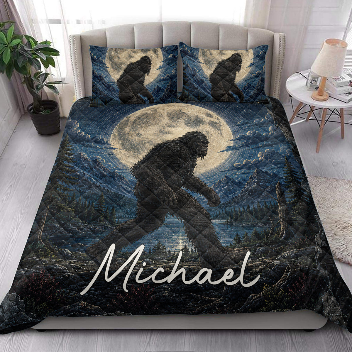 Bigfoot quilt bedding styled in a bright bedroom with moonlit mountain and forest artwork