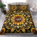 Sunflower quilt bedding styled in a bright bedroom with coordinated floral artwork across the bed