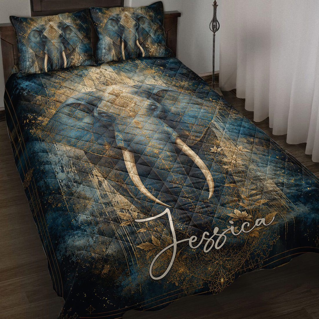 Elephant quilt blanket bedding set in deep blue and gold styled on a bedroom bed