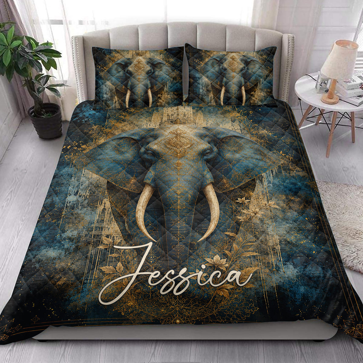 Elephant quilt blanket displayed on a bright bedroom bed with matching elephant artwork