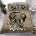 Elephant quilt bedding set styled in a bright bedroom with matching elephant artwork