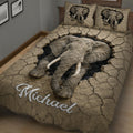 Close bedroom view of an elephant quilt blanket featuring detailed wildlife artwork