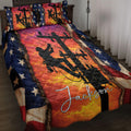 Lineman quilt blanket displayed on a bed with utility worker silhouettes, power lines, and patriotic star accents