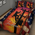 Lineman quilt blanket displayed across a bed with power pole silhouettes, vivid orange artwork, and star accents