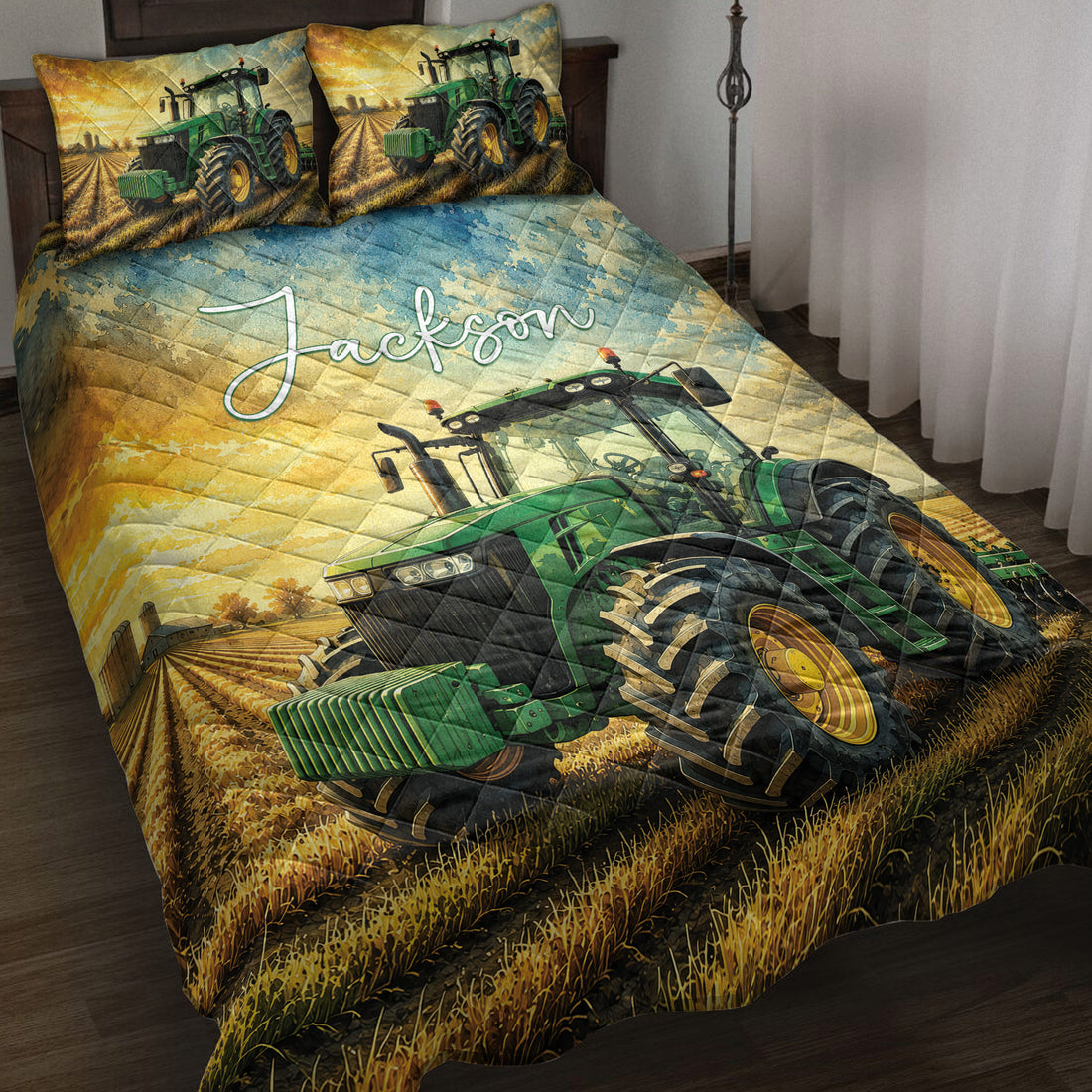 Tractor quilt blanket displayed on a bed with green farm tractor artwork and golden field scenery