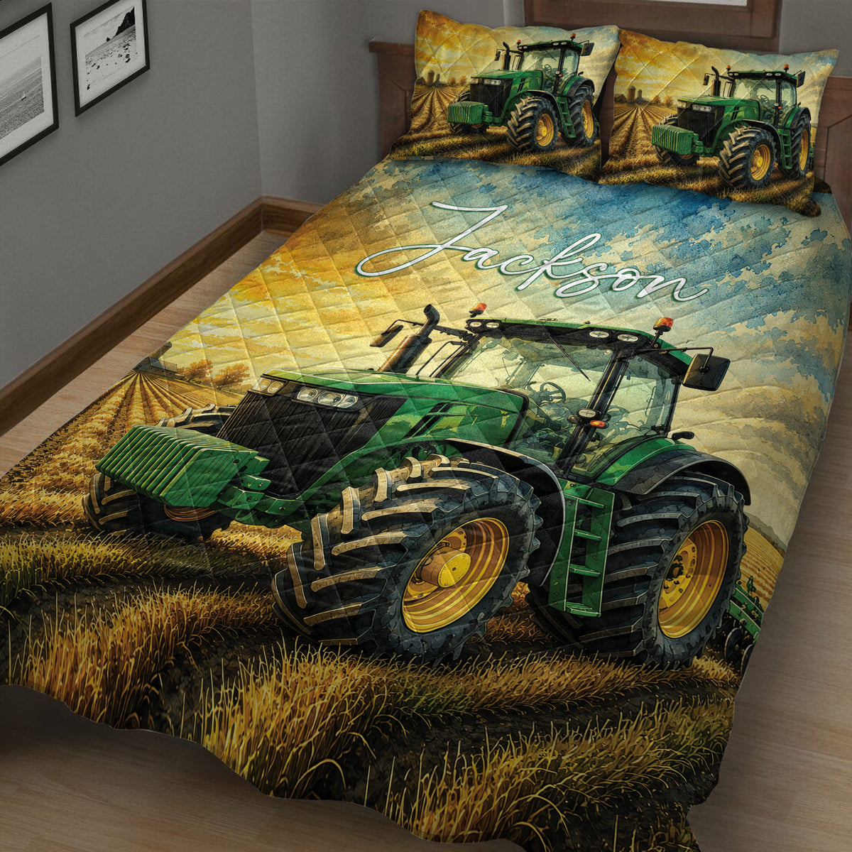 Close view of a tractor quilt blanket featuring a large green tractor in a harvested field
