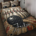 Bowling quilt blanket displayed on a bed with black bowling balls, pins, and vivid red accents