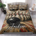 Bowling quilt blanket styled in a bright bedroom with pins, bowling balls, and dramatic red accents