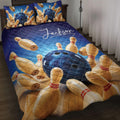 Bowling quilt blanket displayed on a bed with blue bowling ball and pin artwork