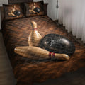 Bowling quilt blanket styled on a bed with bowling pins and black balls in warm brown artwork