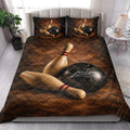 Bowling quilt bedding styled in a bright bedroom with pins and bowling balls across the bed