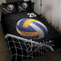 Black volleyball quilt blanket displayed on a bed with blue and gold volleyball artwork and net details