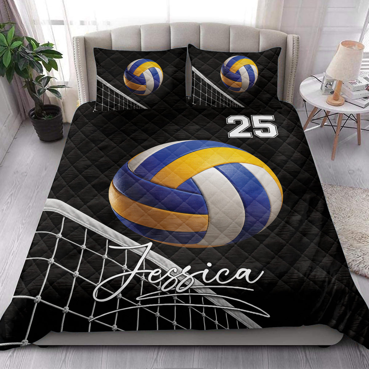 Volleyball quilt blanket styled on a bedroom bed with bold black, blue, gold, and white artwork