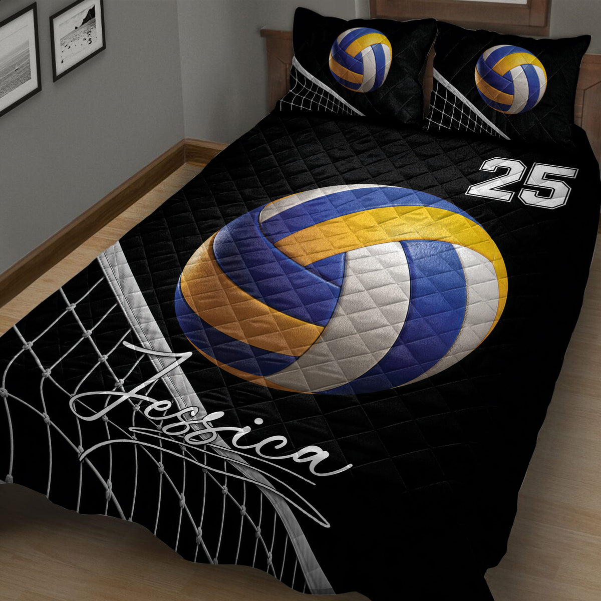 Close-up of a black volleyball quilt blanket with large blue and gold ball and net artwork