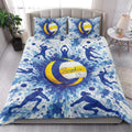 Volleyball quilt bedding styled in a bright bedroom with blue and yellow sports artwork