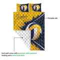 Volleyball quilt blanket detail showing the printed front design and quilted white backing