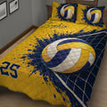 Close bedroom view of a navy and gold volleyball quilt blanket with ball and net graphics