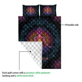 Yoga quilt showing the printed front and white quilted backing with meditating figure artwork