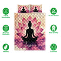 Yoga quilt bedding set shown front-facing with lotus artwork and a meditating silhouette in pink and purple tones
