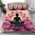 Yoga meditation quilt styled in a bright bedroom with large pink lotus flowers and a seated silhouette