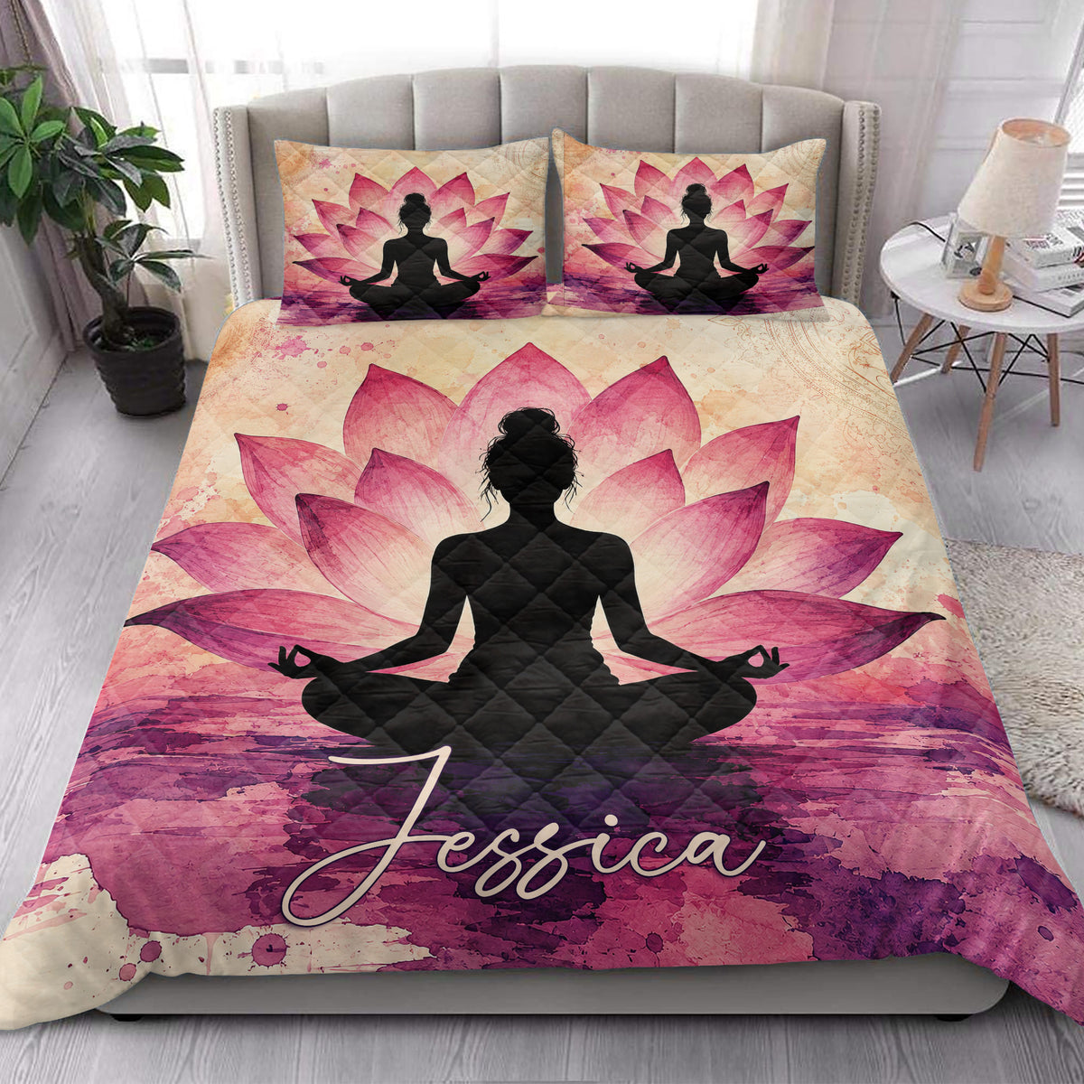 Yoga meditation quilt styled in a bright bedroom with large pink lotus flowers and a seated silhouette