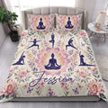 Yoga quilt bedding styled in a bright bedroom with lotus flowers, butterflies, and meditation poses