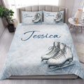 Ice skating quilt bedding styled in a bright bedroom with figure skate artwork and pale blue accents