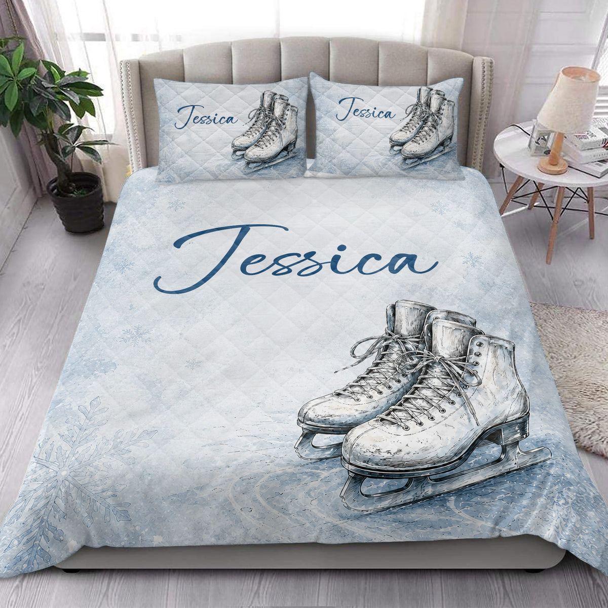 Ice skating quilt bedding styled in a bright bedroom with figure skate artwork and pale blue accents