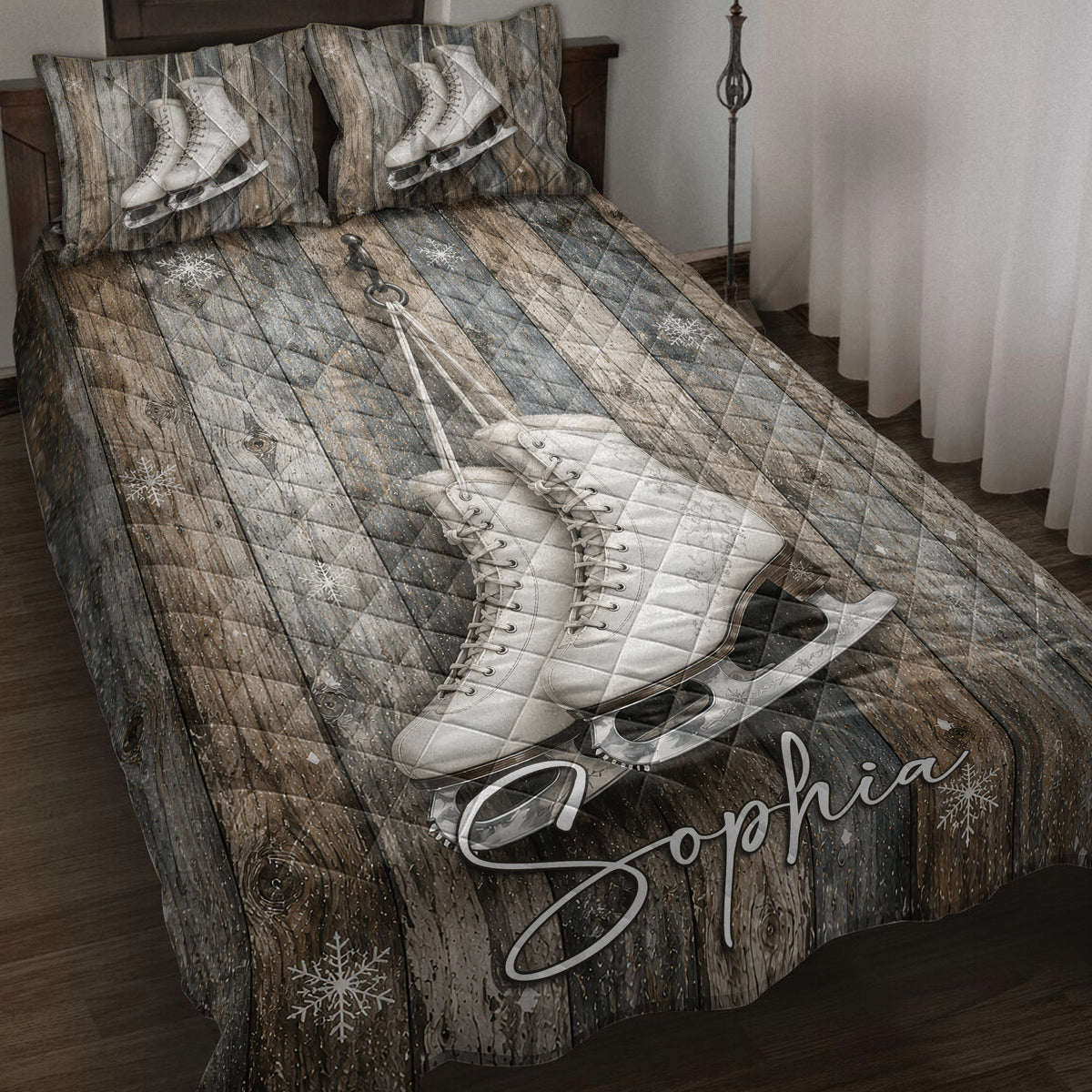 Ice skating quilt blanket displayed on a bed with white figure skates, wood plank artwork, and snowflakes