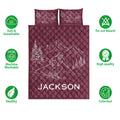 Burgundy ski quilt bedding set with skier artwork, mountain scenery, and feature icons