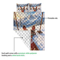 Skiing quilt showing the printed mountain side and white diamond-stitched backing