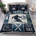 Skiing quilt blanket styled in a bright bedroom with mountain scenery, skier artwork, ski boots, and crossed skis