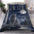 Russian Blue cat quilt blanket styled on a bright bedroom bed with moon, forest, and starry artwork