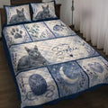 Russian Blue cat quilt blanket displayed on a bed with lavender flowers, paw prints, fish, hearts, and moon artwork