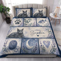 Russian Blue cat quilt blanket styled in a bright bedroom with cat portraits, flowers, paw prints, and moon panels