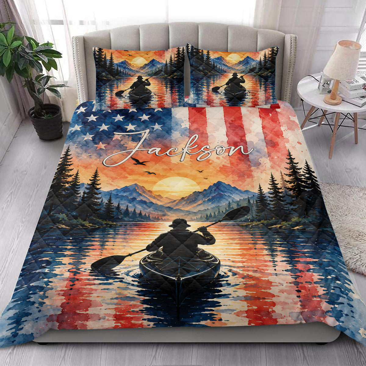 Kayak quilt bedding styled in a bright bedroom with mountain, forest, sunset, and paddler artwork