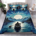 Kayak quilt blanket styled in a bright bedroom with mountain lake artwork and a paddler on the water