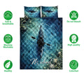 Kayak quilt bedding set shown front-facing with blue water artwork and soft breathable feature icons