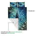Kayak quilt showing the printed blue water side and white quilted backing in a detail presentation