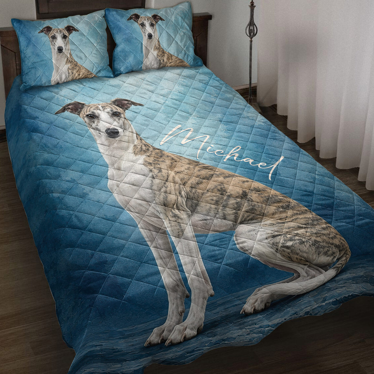 Blue Whippet quilt blanket displayed on a bed with matching Whippet pillow artwork