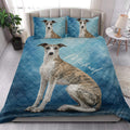 Whippet quilt blanket styled on a modern bed in a bright bedroom