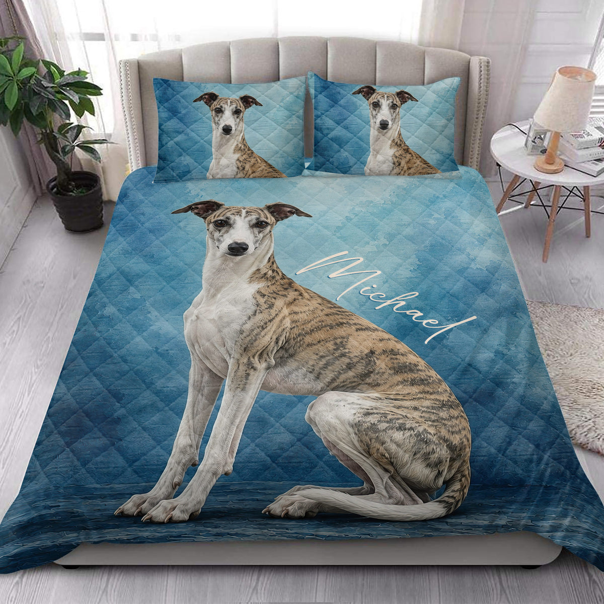 Whippet quilt blanket styled on a modern bed in a bright bedroom