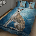 Blue Whippet quilt blanket displayed across a bed with matching dog artwork