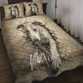 Whippet quilt blanket displayed on a bed with two matching dog portrait pillows and cracked-wall artwork