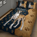 Close bedroom view of a Whippet quilt blanket with large sighthound artwork and paw prints
