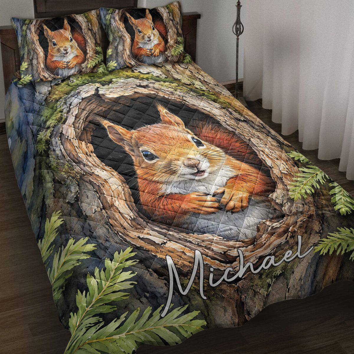 Squirrel quilt blanket displayed on a bed with woodland trees, ferns, and a large orange squirrel design